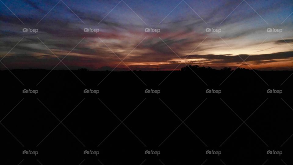 Dark colorful sunset cloudscape.
