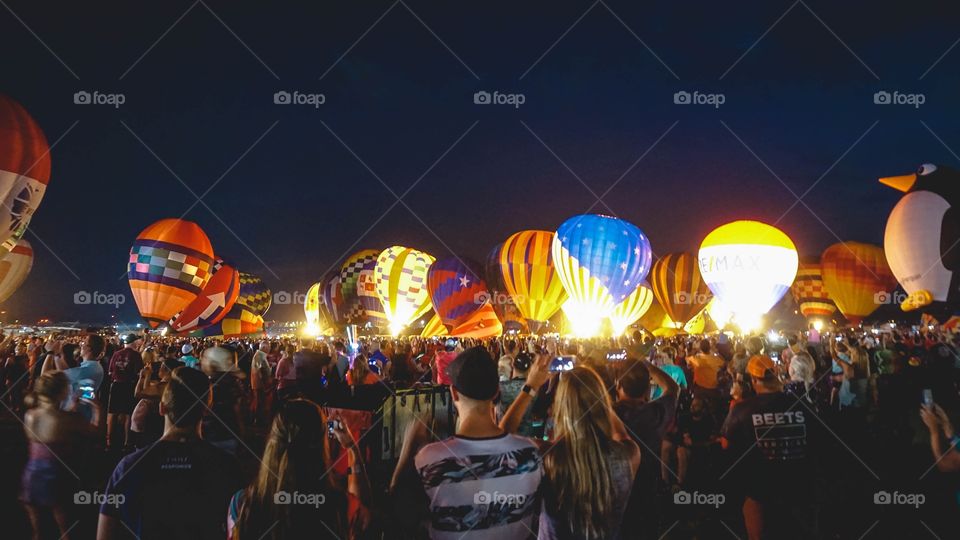 The Balloon Glow at the Great Texas Balloon Race, a field of hot-air balloons lit up at night