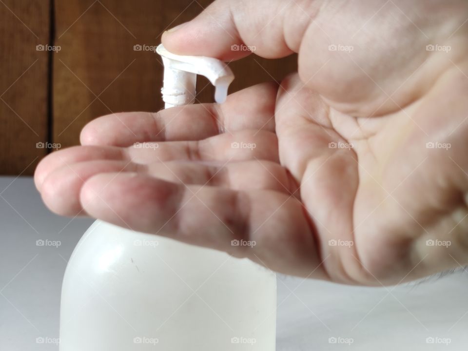 Sanitary gel on one hand