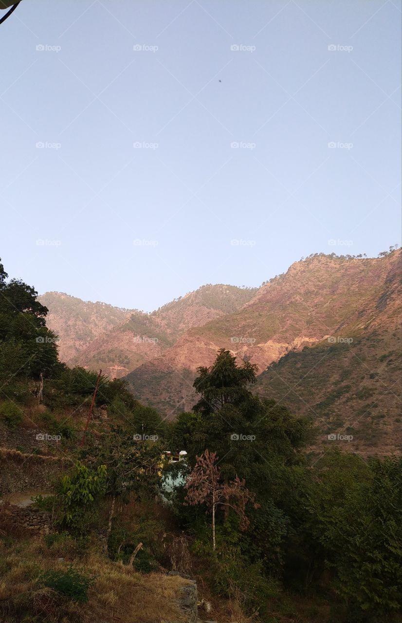 First rays of the sun on the Dashrath mountains in my village