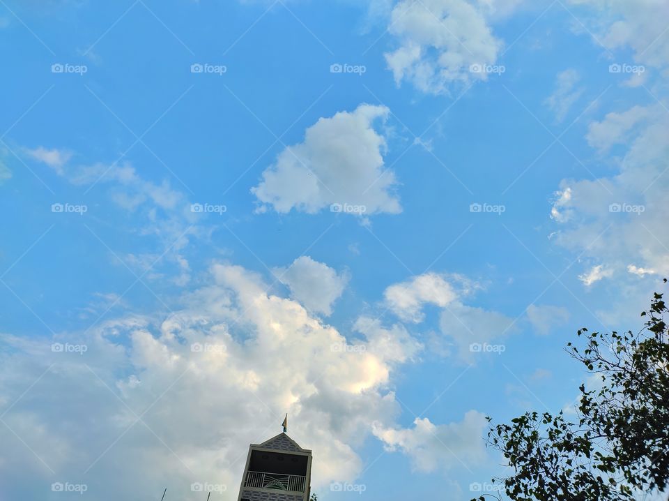Blue sky with clouds from down view