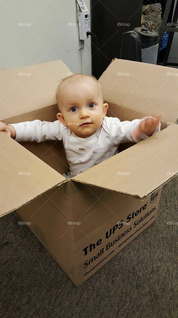 Baby playing in Box