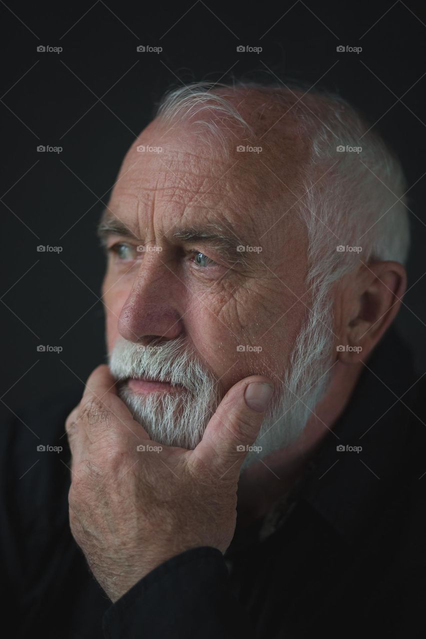 Portrait of an adult, emotions, wrinkles and the history of a person’s life in one portrait. Unique face skin stories