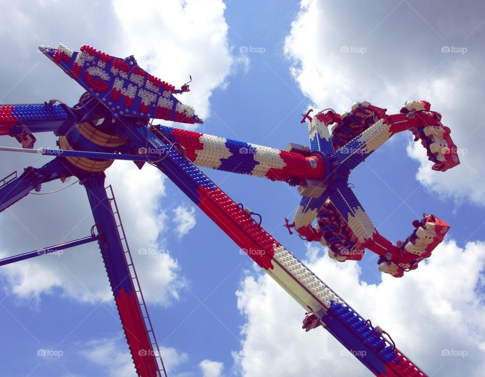 Theme Ride. Amusement park ride gets high up. 