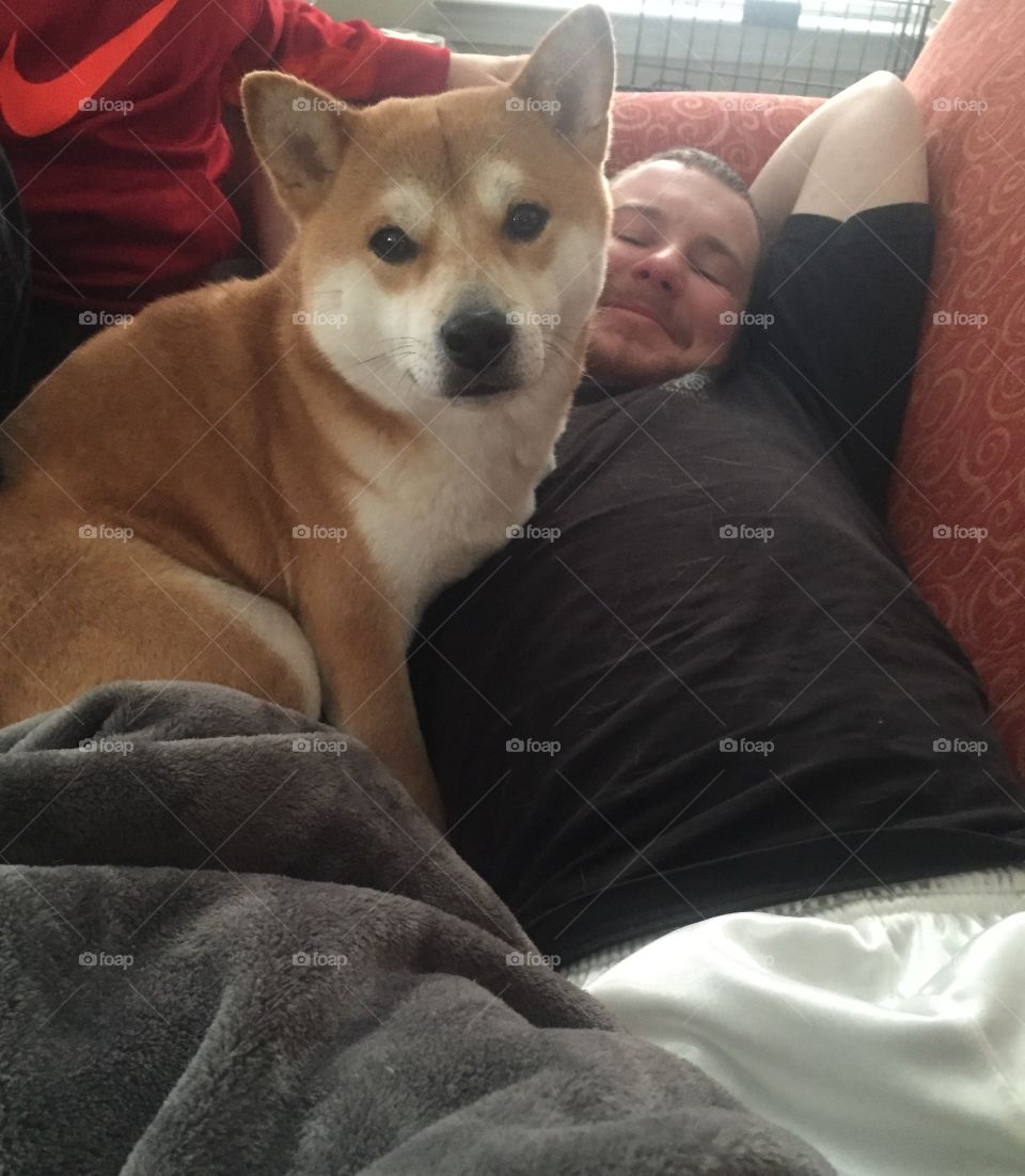 Lounging with man's best friend