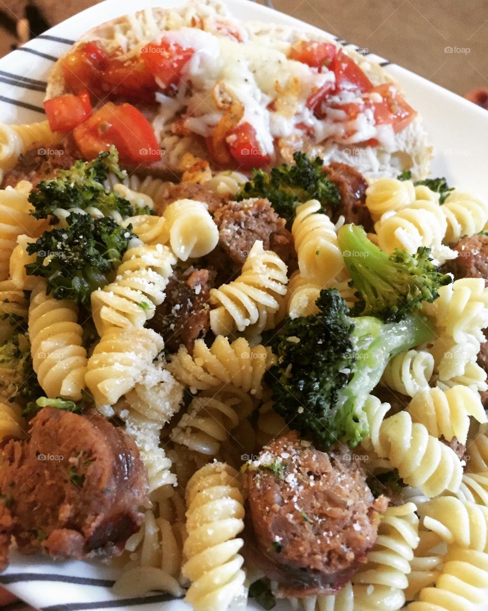 Home made broccoli sausage garlic pasta and tomato bruschetta 