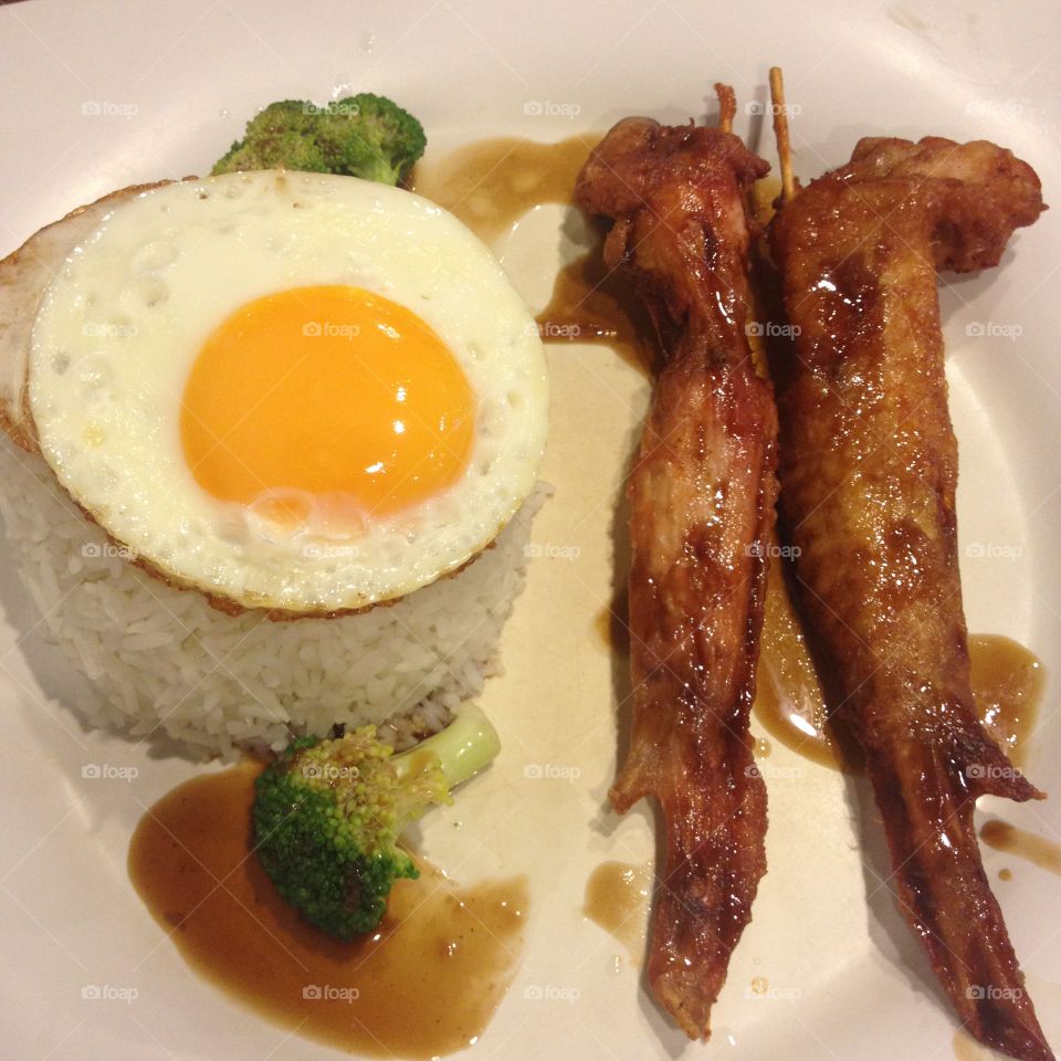 Soy sauce chicken wing with fried egg rice