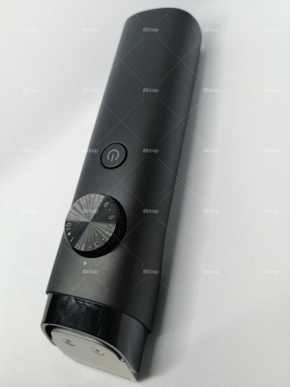 Electric hair clipper or shaver on white background