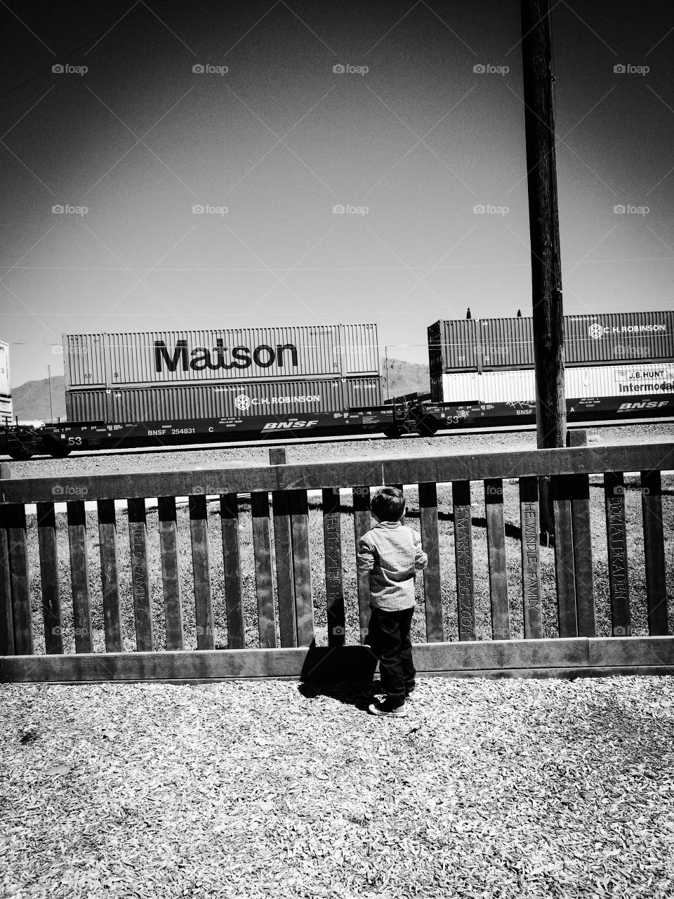 Little boy watching as the train goes by 