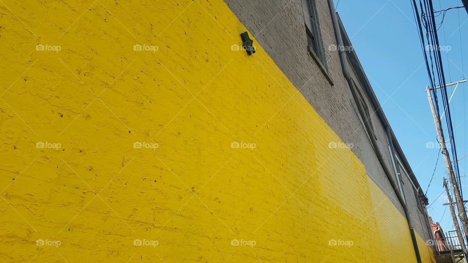 Yellow wall in city