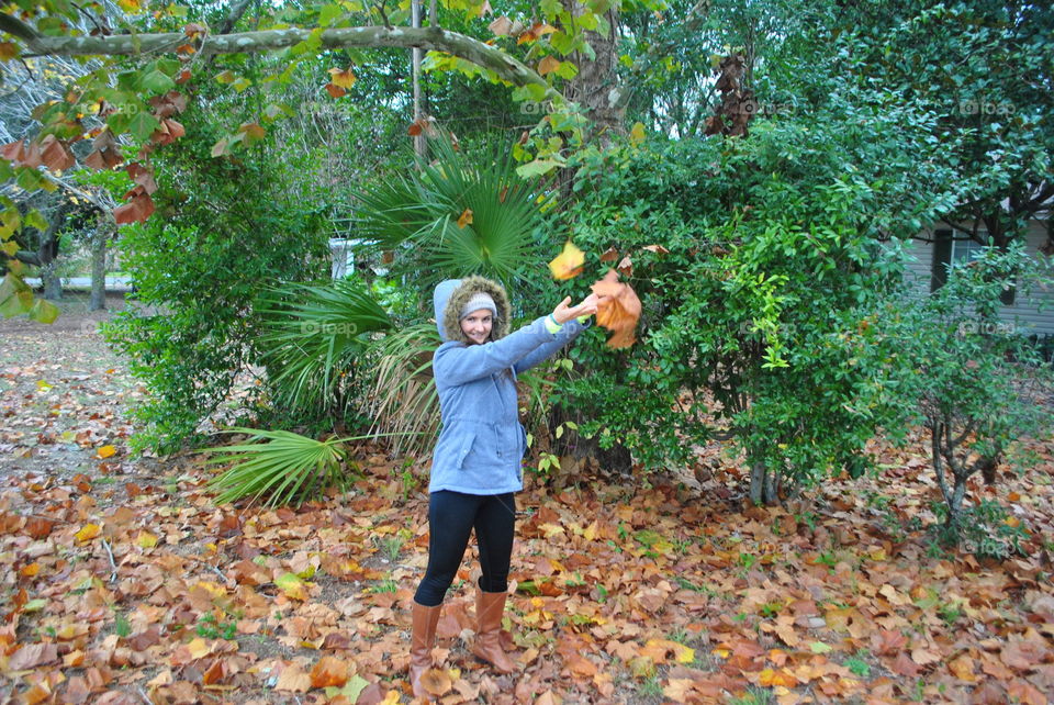 Me playing with the leaves outside