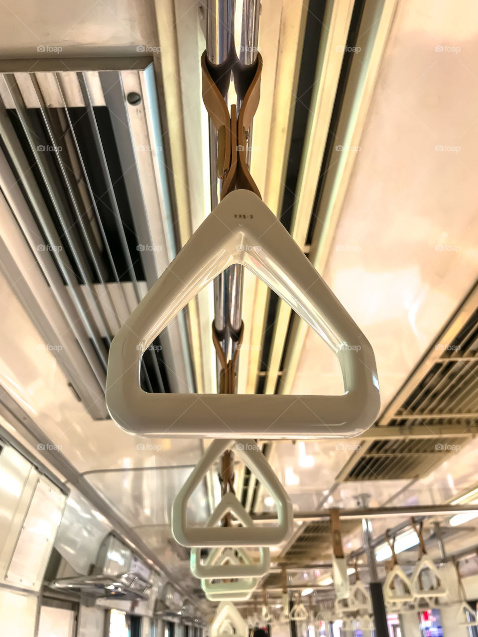 Train handles for standing passengers