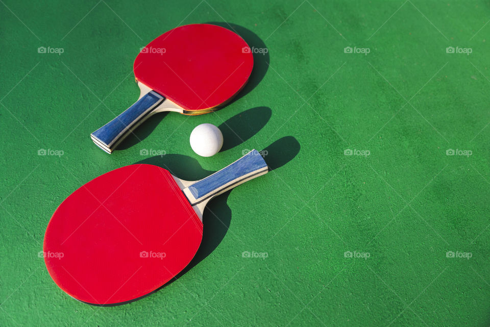 Table tennis rockets and the ball ready for the game