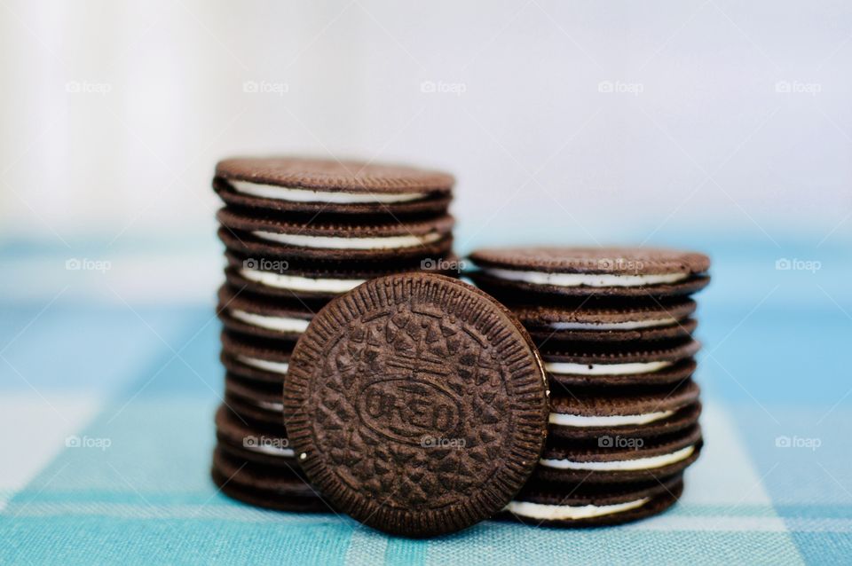 Oreo cookie thins on a white and light blue background 