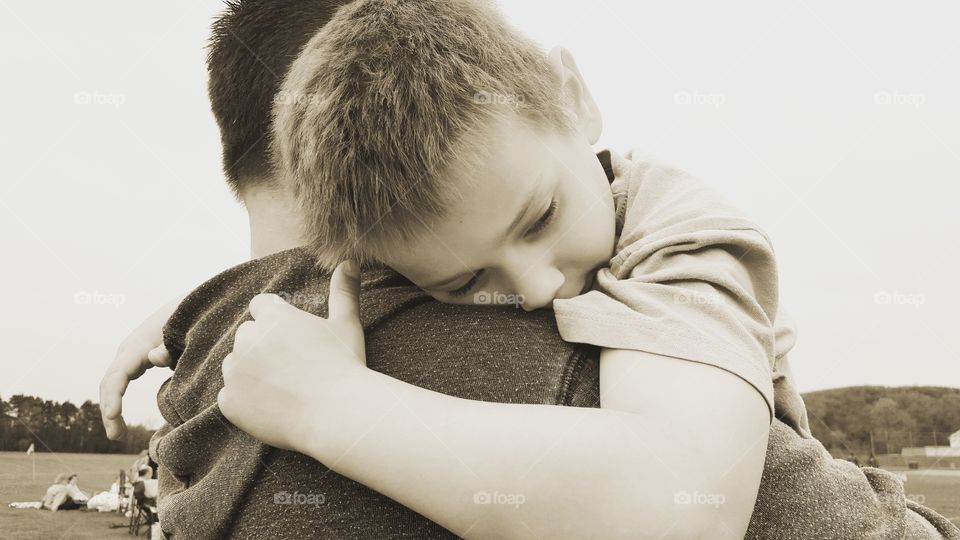 Close-up of a boy with his father