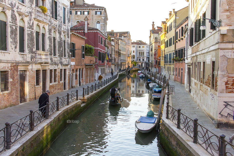 Early evening at a canal in Venice with gondola 