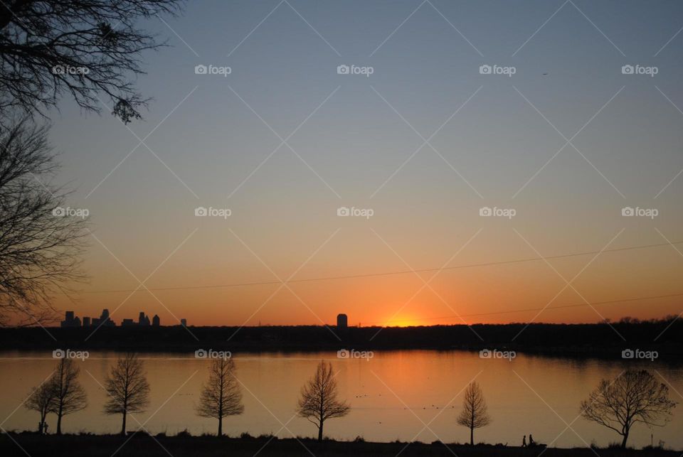 Sunset on a lake. A sunset on White Rock Lake in Dallas