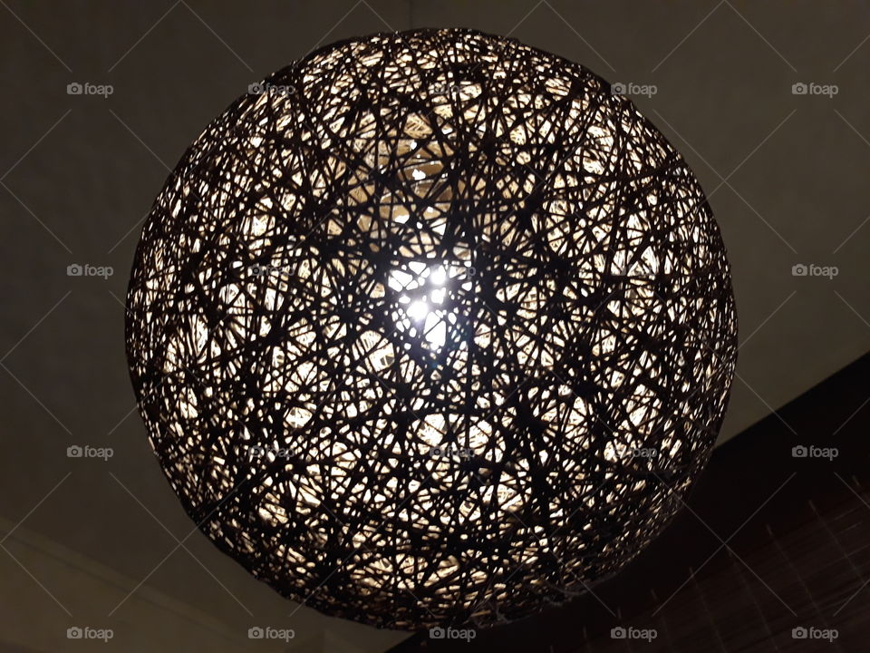 Light Ball decoration. Light is passing out from the ball tiny holes producing a pleasure design.