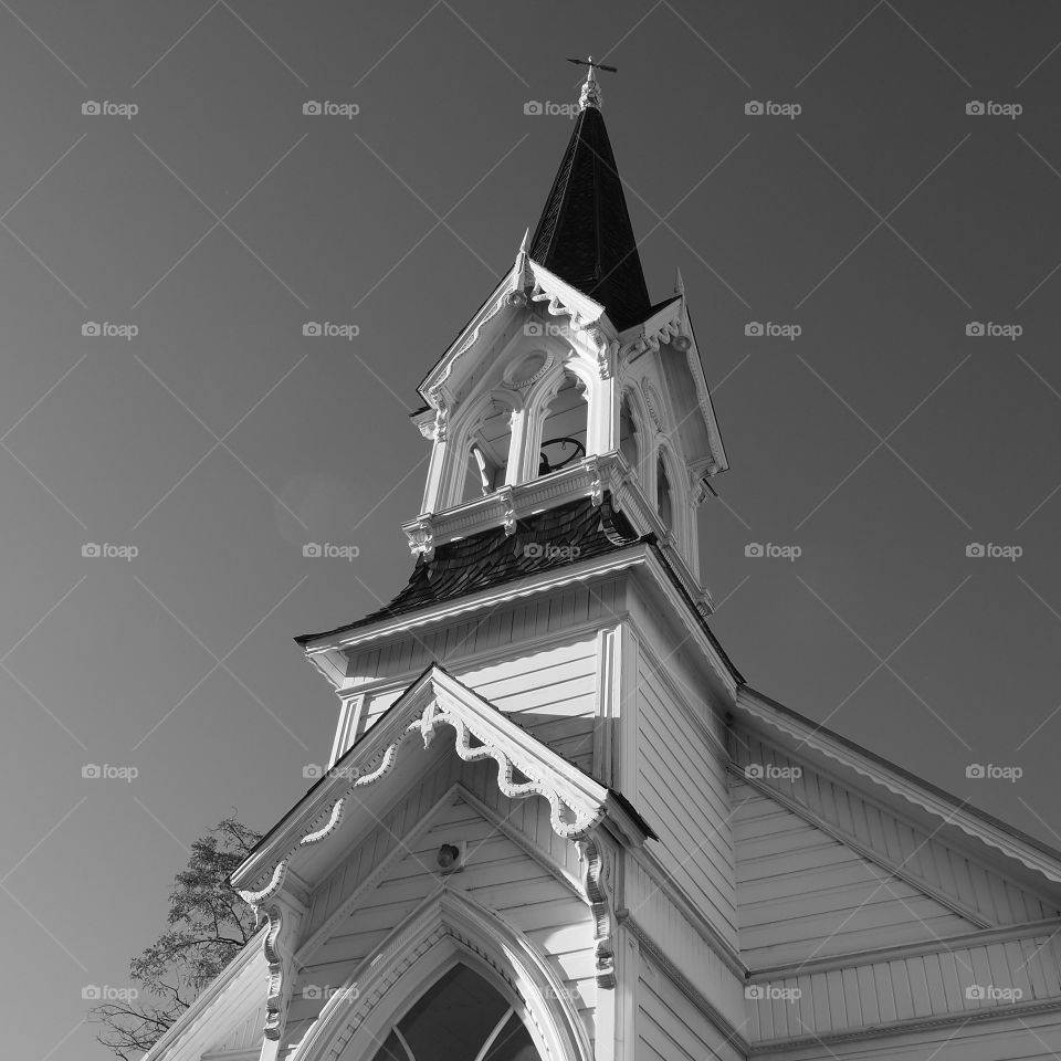 An old church steeple against a rich clear sky in Eastern Oregon. 