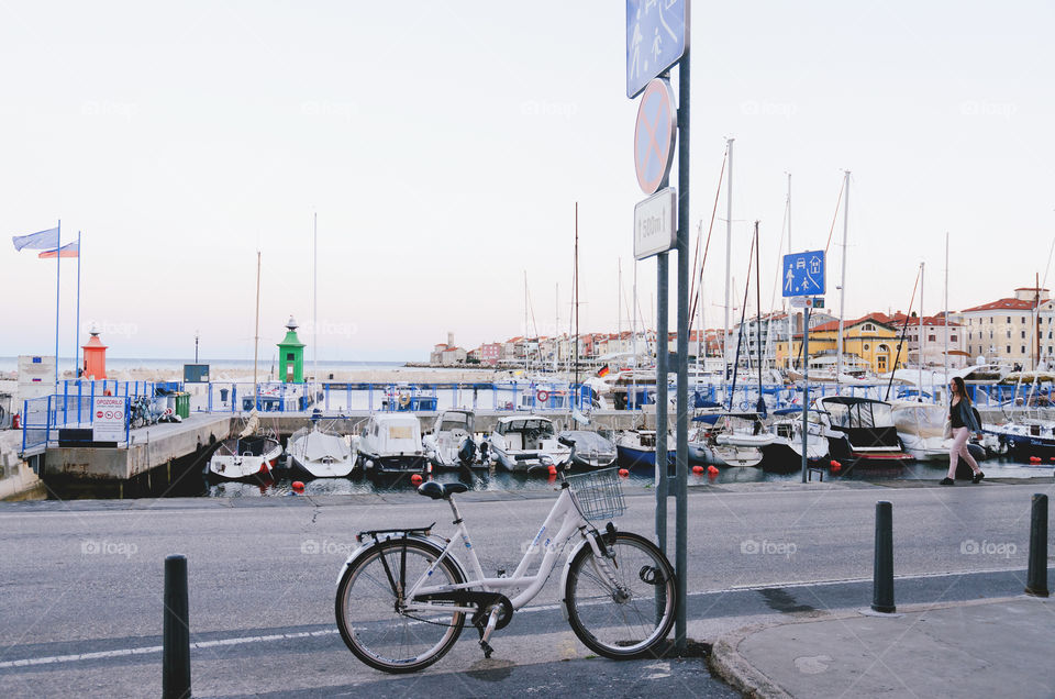 On bicycle at the empty streets of old town Piran at the Adriatic seaside in Slovenia. Healthy lifestyle.