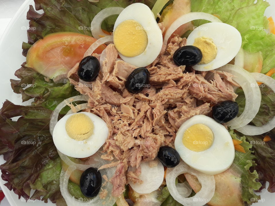 Tuna salad with olives eggs and tomatoes