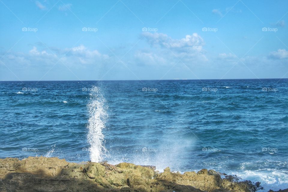 hole on rock in the beach