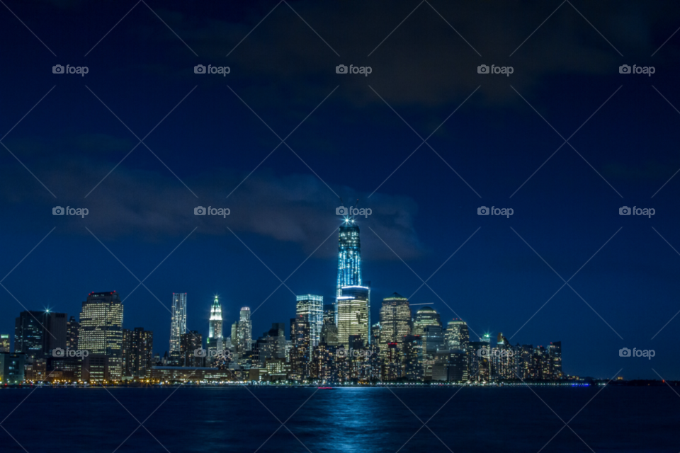 Freedom tower in Manhattan skyline at night in New York City