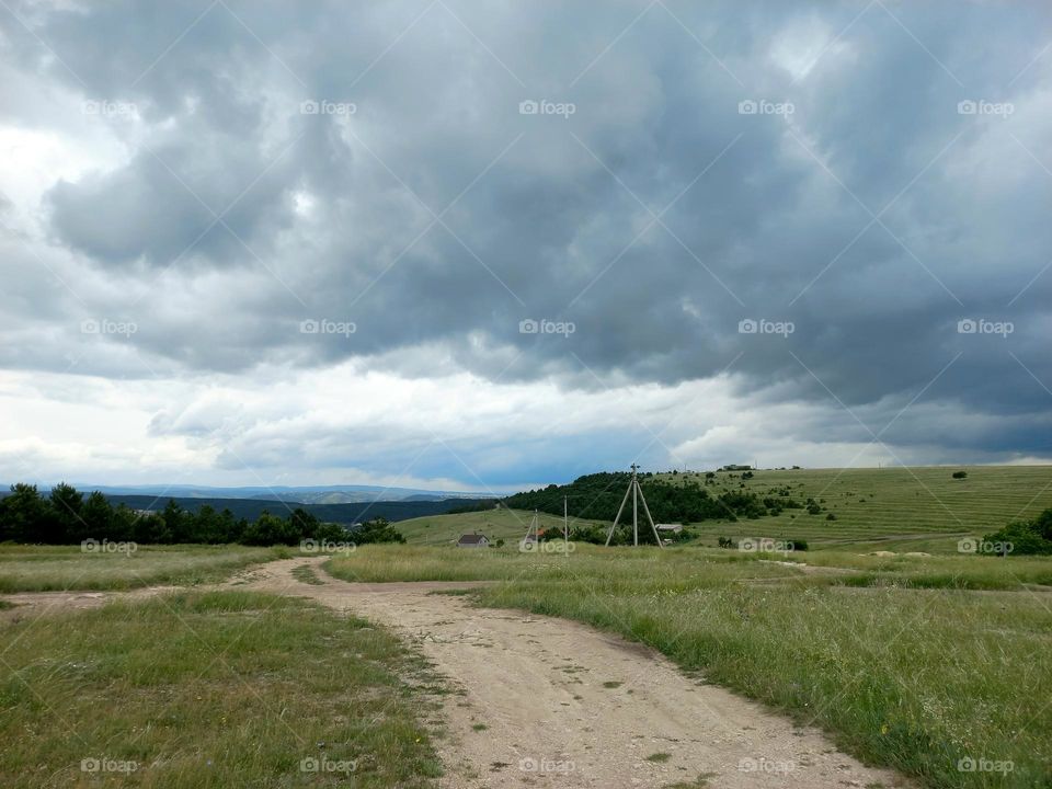 walk along a wide road in the foothill areas .