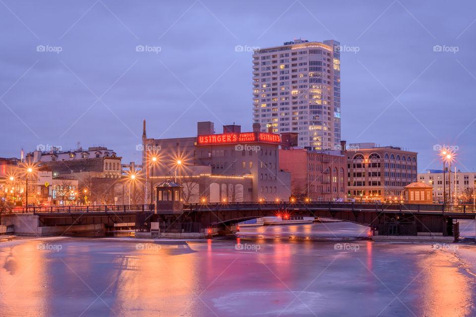 Light reflections on the frozen Milwaukee River in Wisconsin at night
