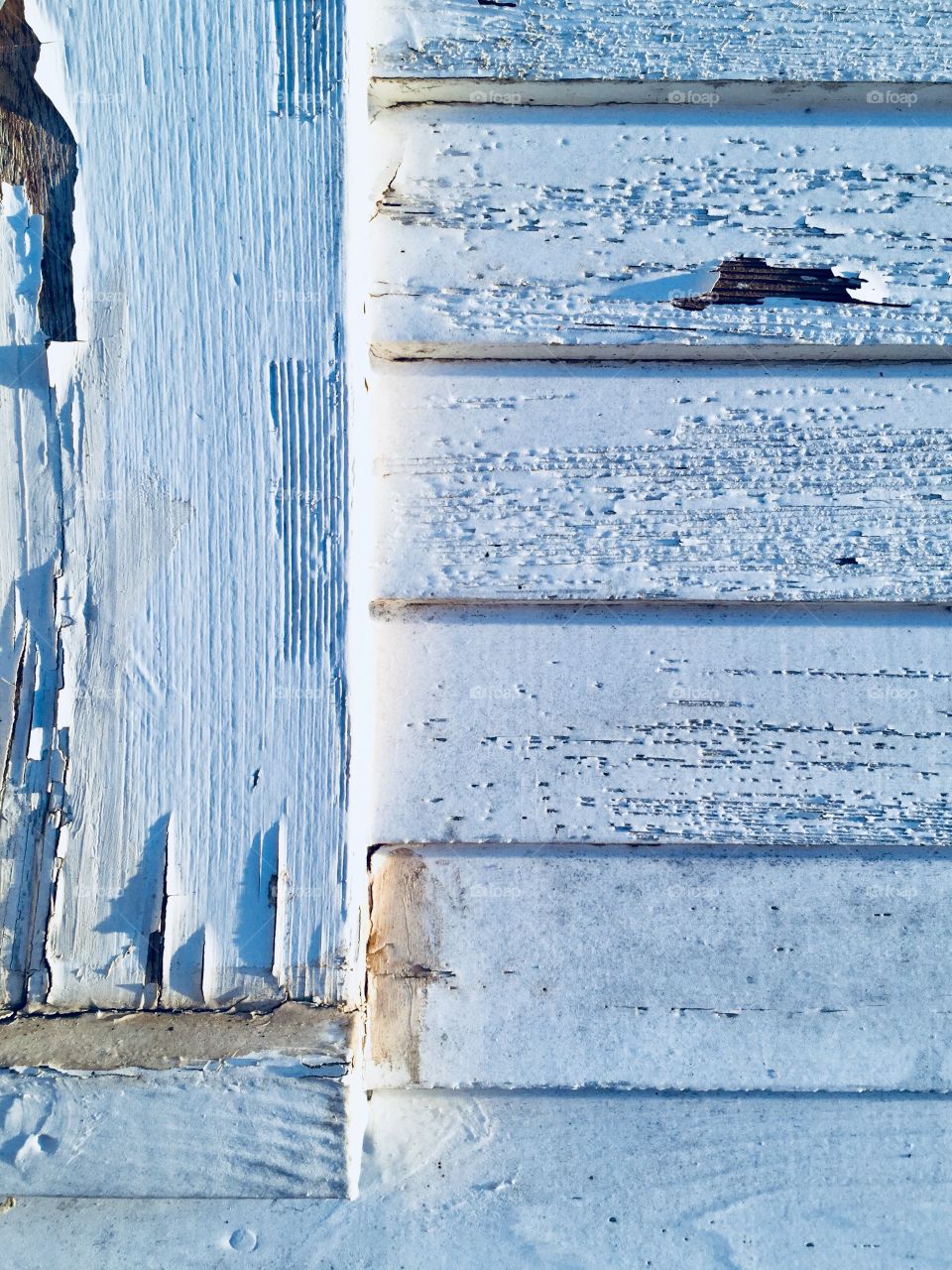 Peeling white paint on wood