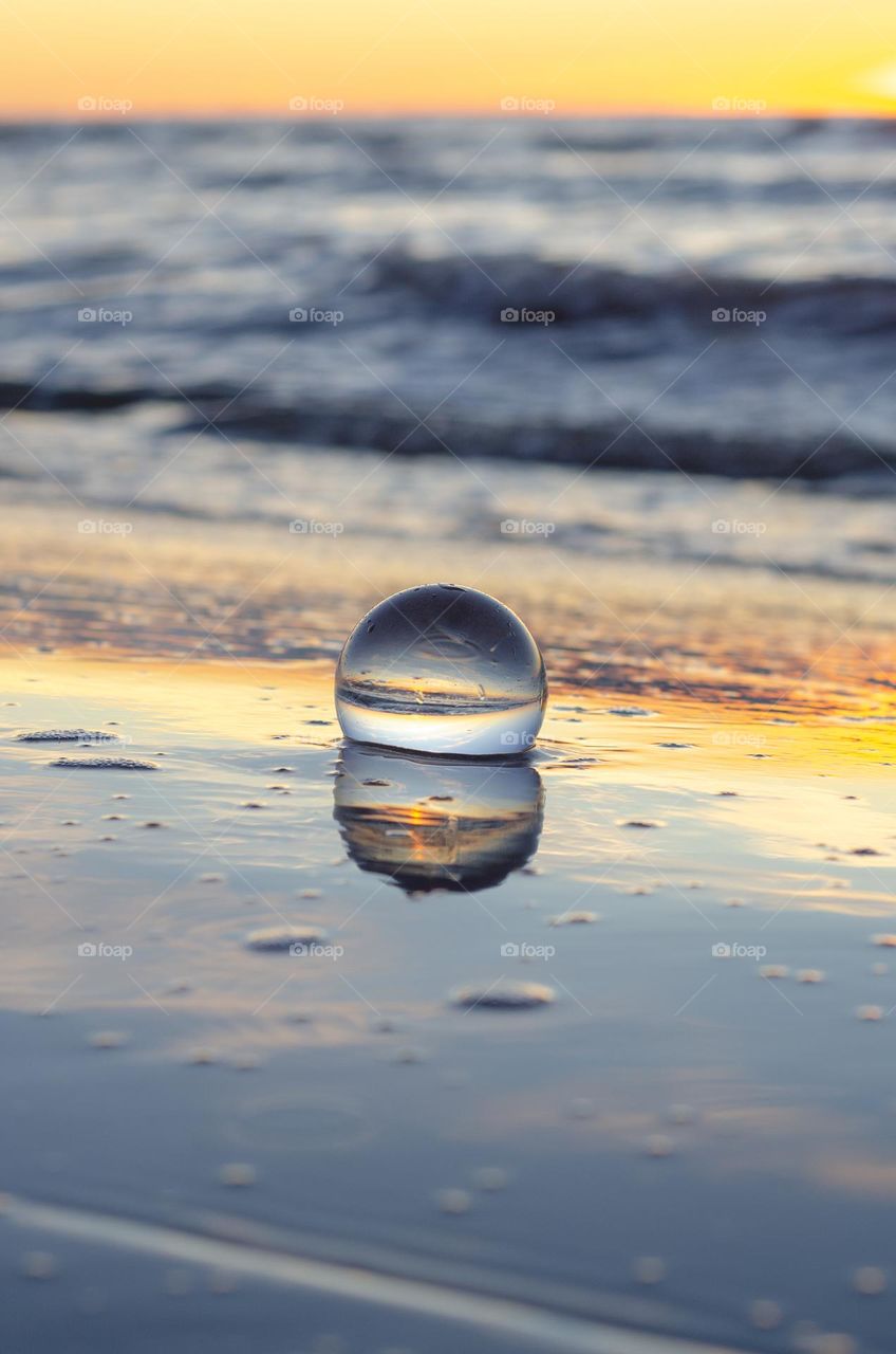 Beautiful and georges Baltic sea sunset through the lensball