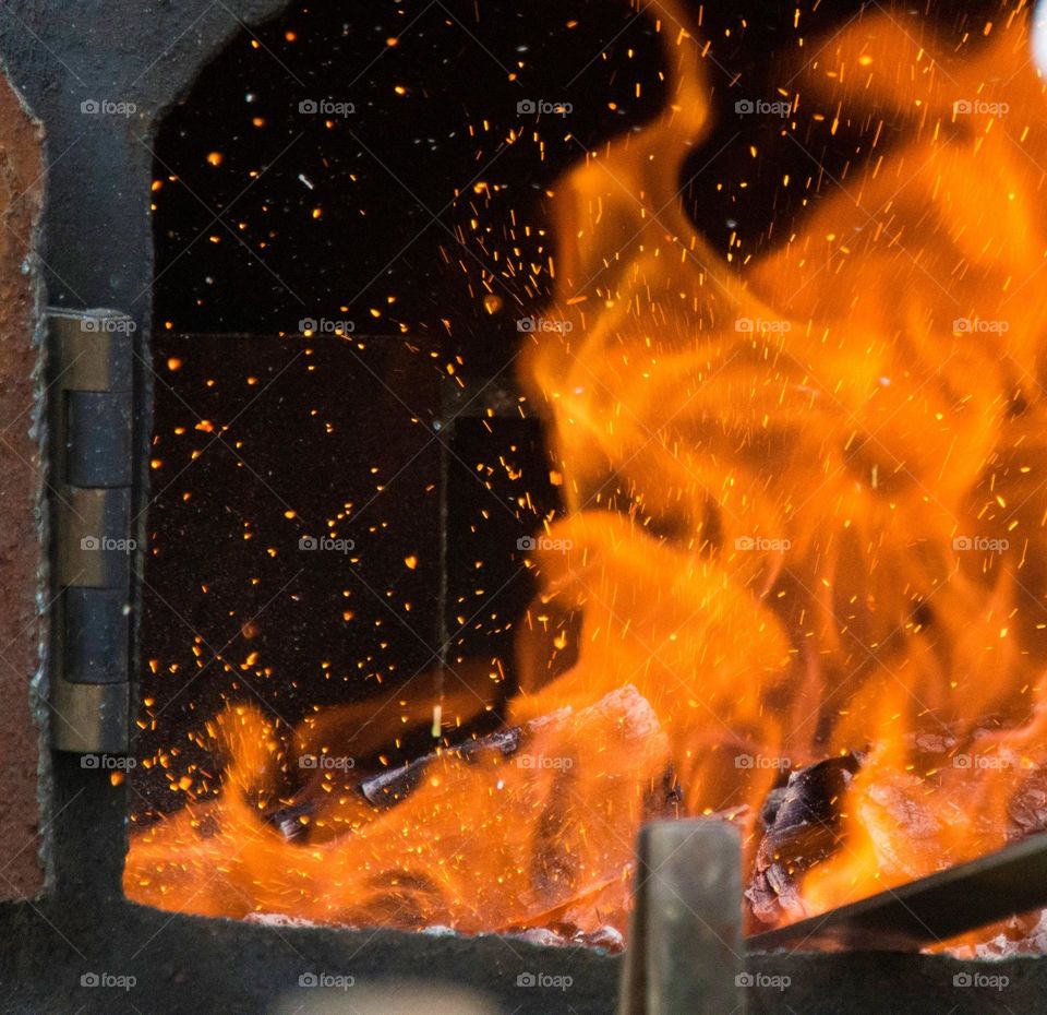 Hot flaming blacksmith furnace for forging steel 