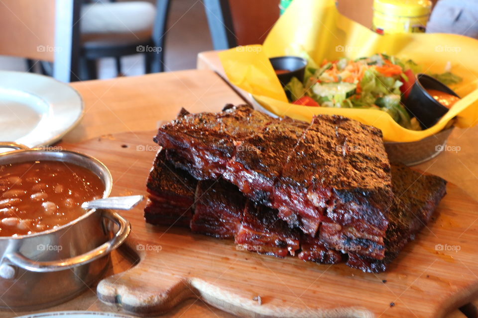 Smoked ribs ,slow cooked beans and fresh salad - all authentic island style 