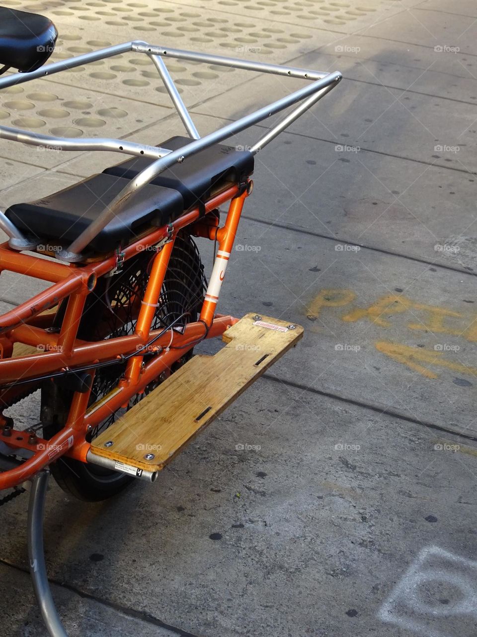 Cool orange back of a bicycle parking 