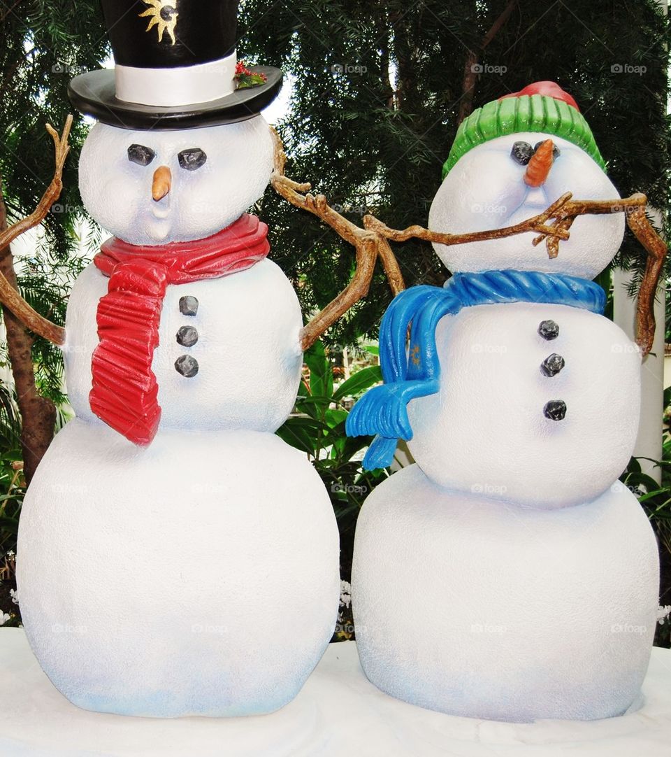 Two tall snowmen