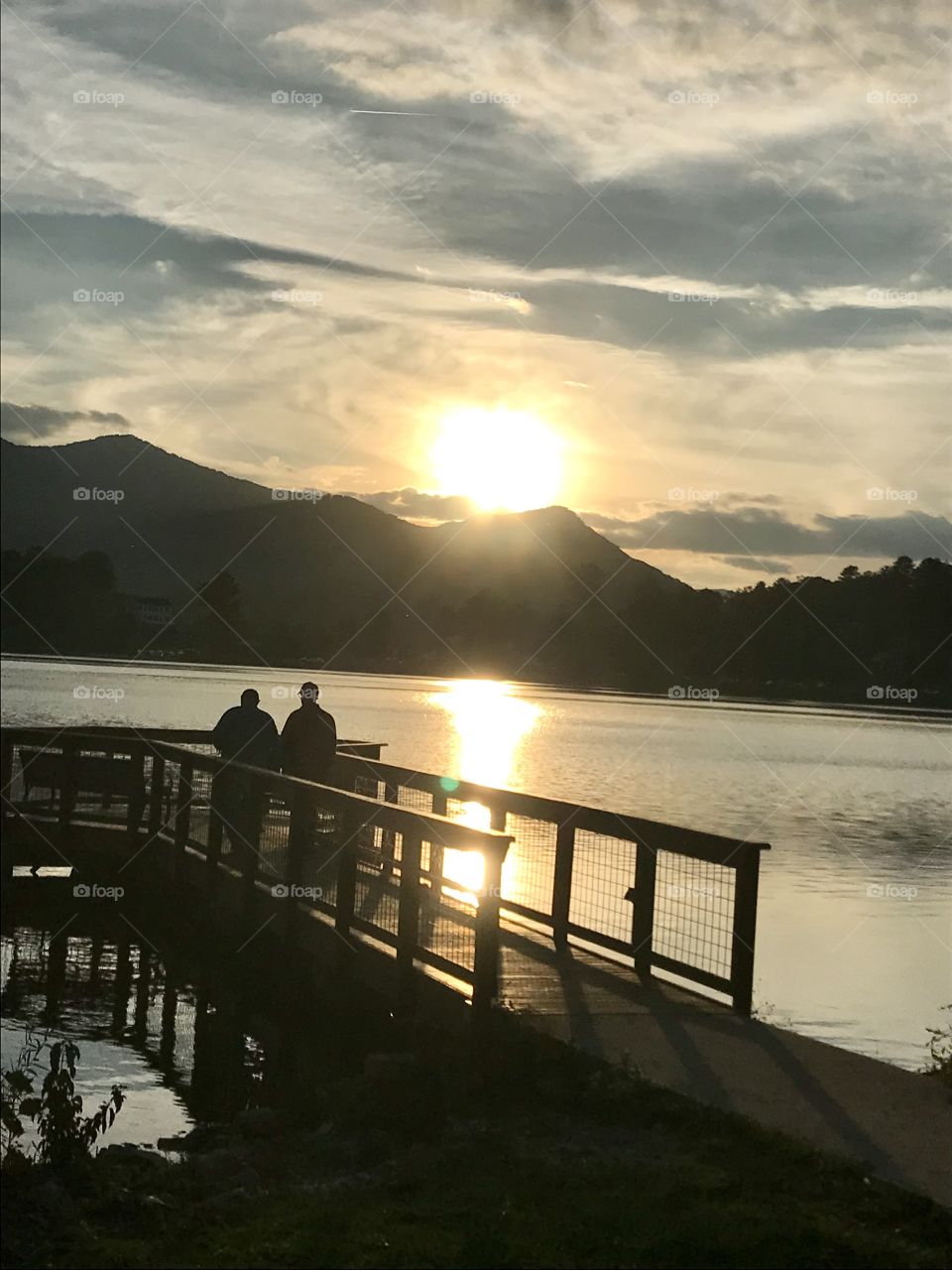 View of the mountain sunset from lake pier