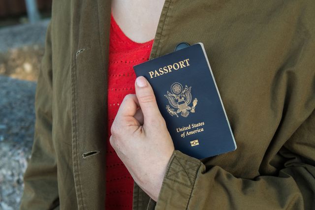 Girl holding US passport