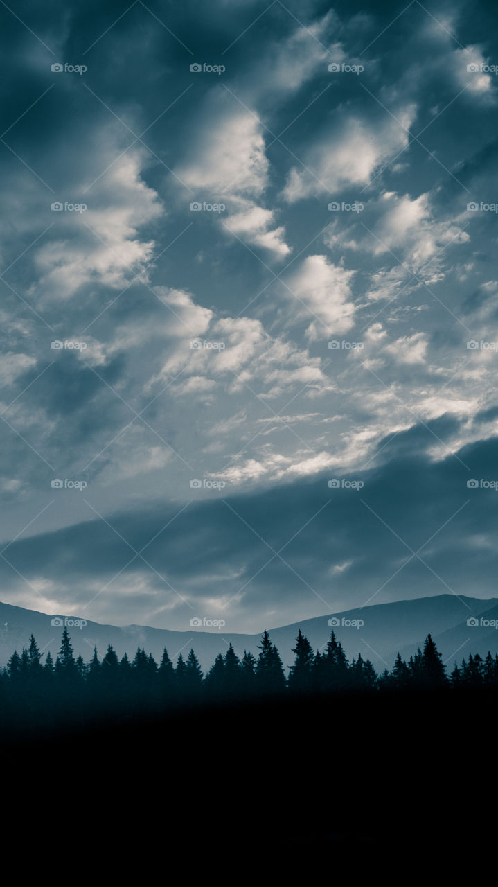 An inspiring mountain landscape. Tatry mountains in Slovakia. A beautiful wallpaper for smartphone screen. Monochrome blue abstract gradient with perspective.