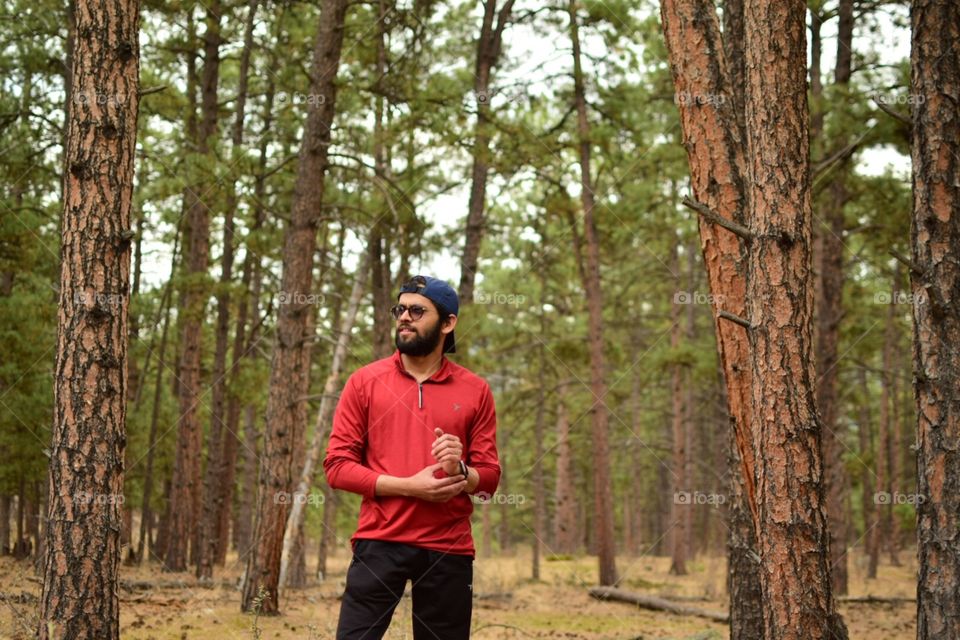 Man standing in woods