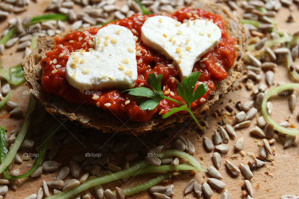 Love sandwich, cheese, seeds and tomato souce