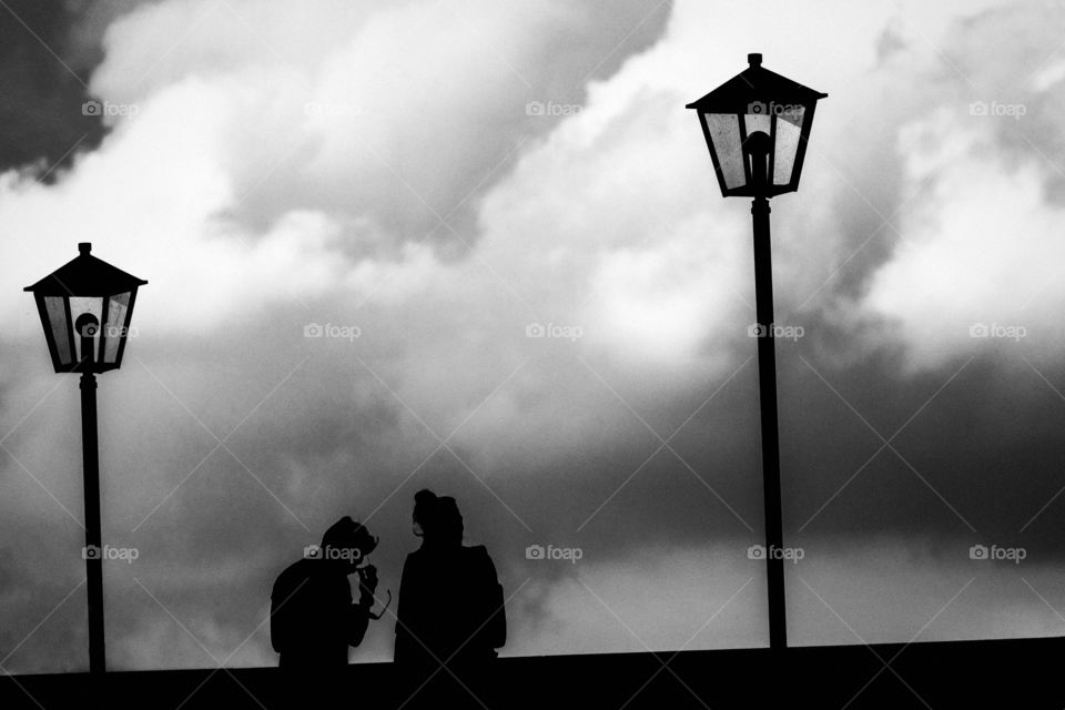Couple on the Stone Bridge in Regensburg / Bavaria / Germany / Silhouette / Monochrome