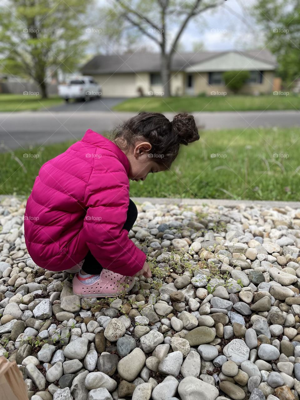 Toddler weeding rock landscape, toddler helps mommy, helping with chores, making the yard look nice, mommy and daughter time, daily chores