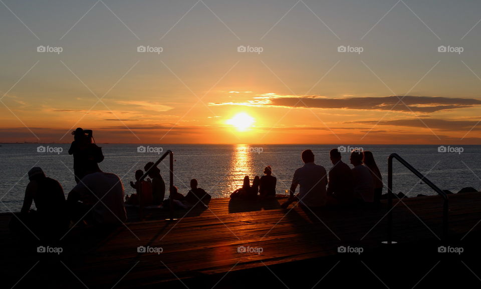 People enjoying the sunset in Malmö.