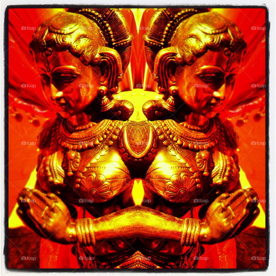 Mirrored brass statue