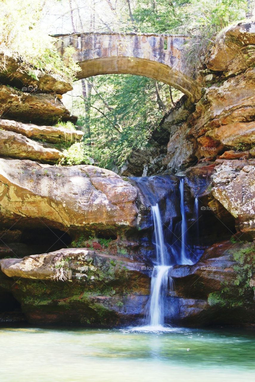 waterfall under bridge