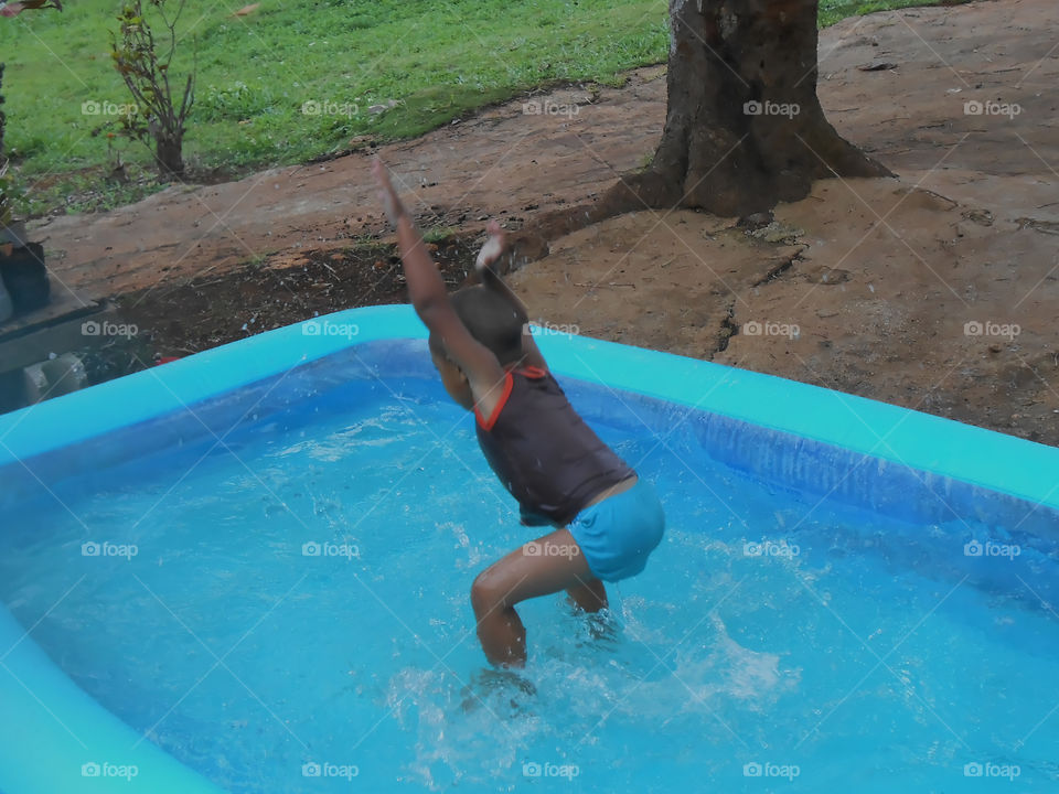 Boy Playing in Water
