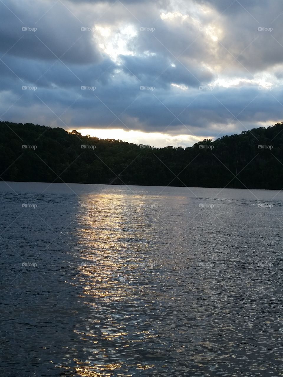 sun setting on the lake