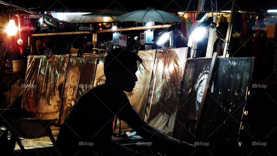 Artist at the chiang Mai market, northern Thailand