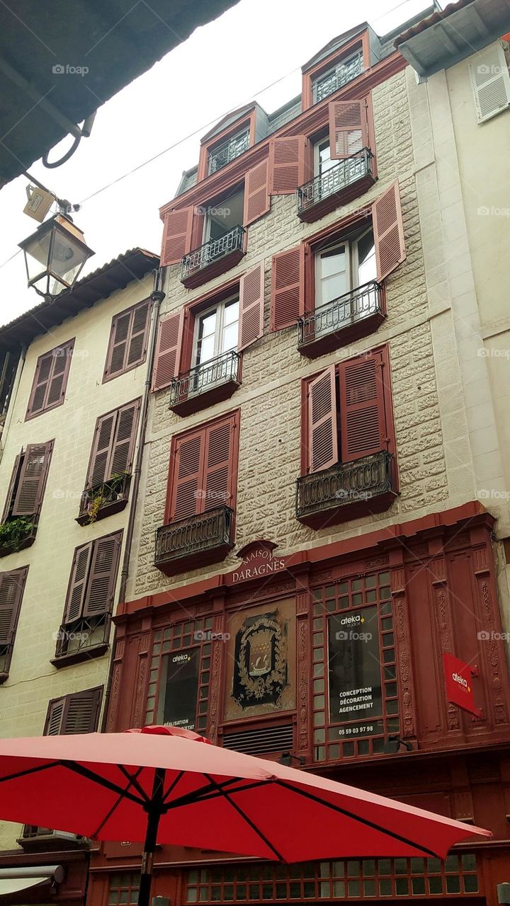 Looking at this building in the historic city center of the city of Bayonne in France, one imagines the life of the inhabitants behind the open or closed shutters on a hot summer day.