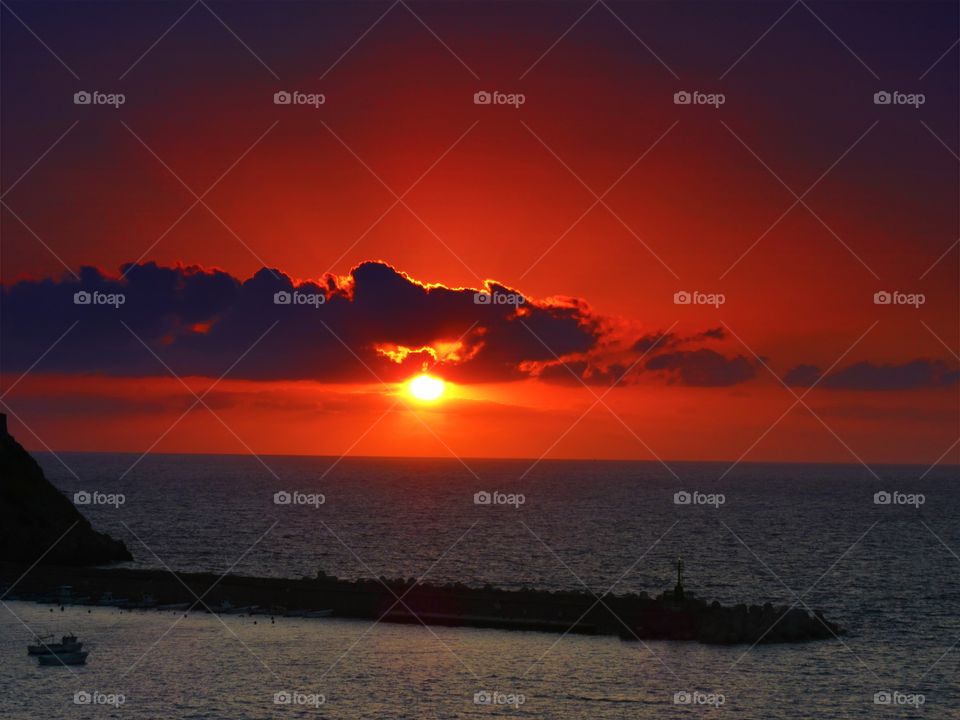 Sun over the port of Palinuro ( Italy ).